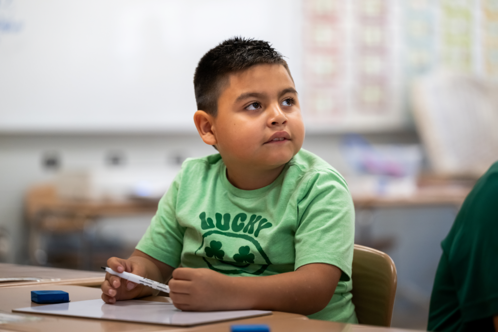Christopher, a student at the Dreamcatchers summer learning program at Susan Moore Elementary School in Blount County, Alabama, listens during class. Photo by Bita Honarvar for FHI 360.